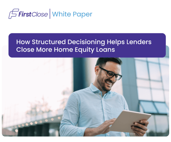 Businessman using tablet with FirstClose White Paper on structured home equity loans.